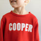 Red roll neck sweater